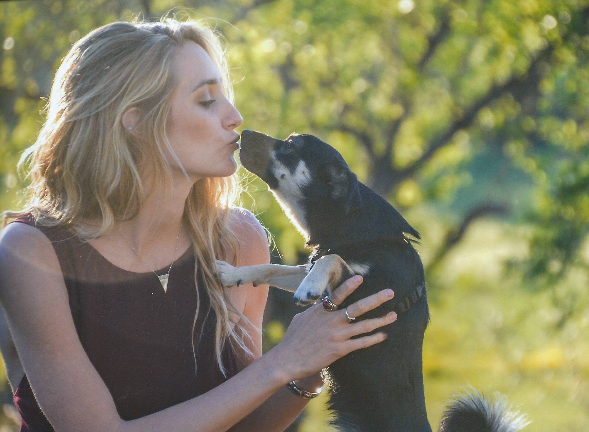 Blonde girl with small black dog